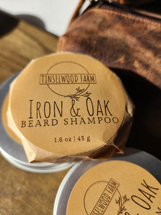 Iron & Oak beard shampoo with a leather pouch in the background.